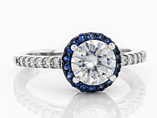 MOISSANITE FIRE(R) 1.44CTW DEW ROUND AND .32CTW ROUND BLUE SAPPHIRE PLATINEVE(R) RING - Size 9