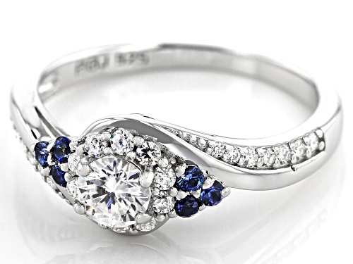 MOISSANITE FIRE(R) .67CTW DEW ROUND  AND .13CTW ROUND BLUE SAPPHIRE PLATINEVE(R) RING - Size 11