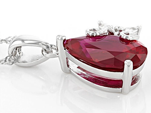 3.86ct Pear Shape Lab Created Ruby & 0.07ctw White Topaz Rhodium Over Silver Pendant W/Chain