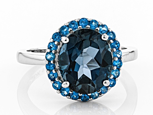 3.74ct Oval London Blue Topaz With .37ctw Round Neon Apatite Rhodium Over Silver Halo Ring - Size 8