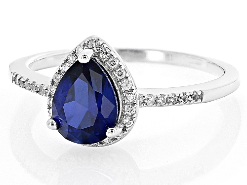 Pre-Owned 1.15ct Pear Shape Lab Created Blue Sapphire With 0.26ctw White Zircon Rhodium Over Silver - Size 9