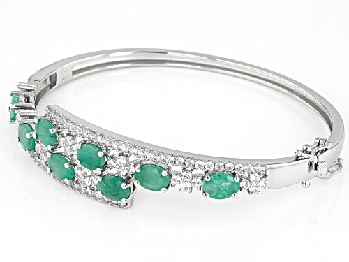 Pre-Owned 5.5ctw Green Emerald And White Zircon Rhodium Over Sterling Silver Bypass Bracelet - Size 7.25
