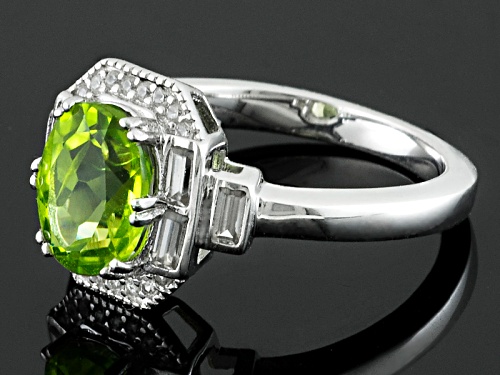 Pre-Owned 2.11ct Oval Manchurian Peridot™ With .59ctw Baguette And Round White Zircon Silver Ring - Size 12
