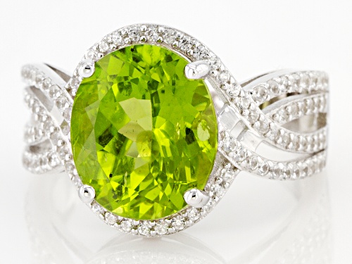 Pre-Owned 4.50ctw Oval Green Peridot With 0.57ctw Round White Zircon Rhodium Over Silver Ring - Size 7