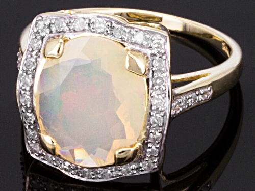 Pre-Owned 1.87ct Oval Ethiopian Opal With .20ctw Round White Diamond 10k Yellow Gold Ring - Size 5