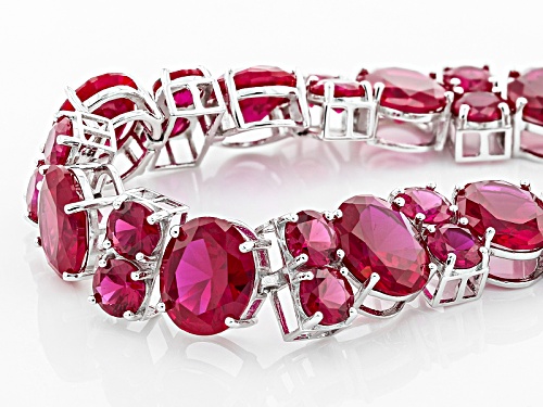 74.97ctw Oval And Round Lab Created Ruby Sterling Silver Bracelet - Size 7.25