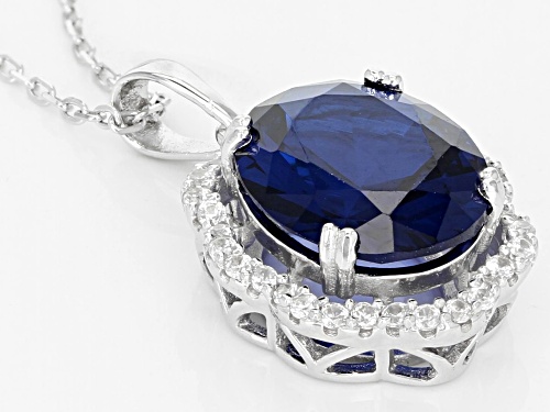 4.05CT OVAL LAB CREATED BLUE SPINEL WITH .39CTW ROUND ZIRCON STERLING SILVER PENDANT WITH CHAIN