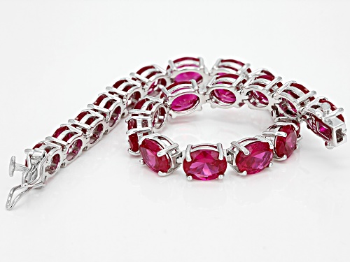 26.13ctw Oval Lab Created Ruby Rhodium Over Sterling Silver Tennis BraceletT - Size 7.25