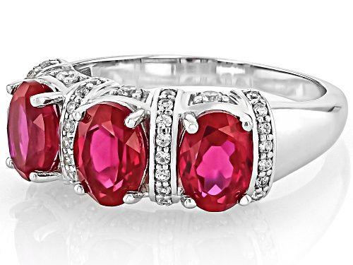 2.95ct Oval Lab Created Ruby With .042ctw Round White Zircon Rhodium Over Silver Ring - Size 6
