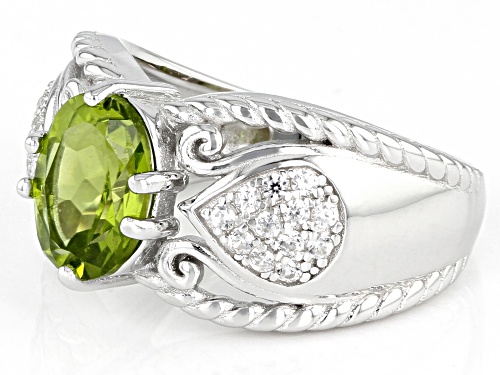 1.64ctw Oval Manchurian Peridot(TM) With 0.39ctw Round White Zircon Rhodium Over Silver Ring - Size 8