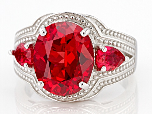 5.70ct Oval and 0.78ctw Pear Shape Lab Created Padparadscha Sapphire Rhodium Over Silver Ring - Size 7