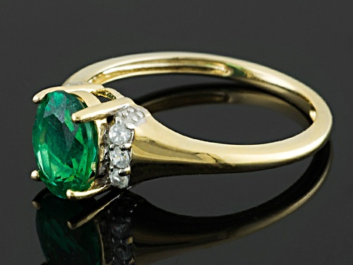 1.10ct Oval Emerald Color Apatite And .12ctw Round White Zircon 10k Yellow Gold Ring - Size 7