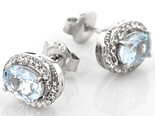 1.19ctw oval aquamarine with .30ctw round white  zircon rhodium over sterling silver drop earrings