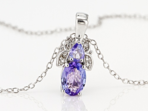 .78CTW OVAL AND PEAR SHAPE TANZANITE WITH .03CTW WHITE ZIRCON RHODIUM OVER  SILVER PENDANT/CHAIN