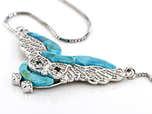 Blue fancy shaped turquoise with 0.02ctw spinel and 0.06 zircon sterling silver necklace.