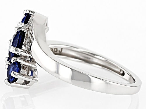 1.33ctw Round Lab Created Blue Sapphire With .07ctw White Zircon Rhodium Over Silver Bypass Ring - Size 10