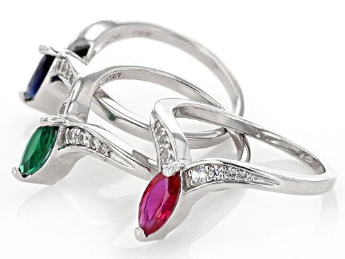 .48ct Lab Emerald, .55ct Lab ruby, .84ctw Lab Blue & Lab White Sapphire Rhodium Over Silver Ring Set - Size 7