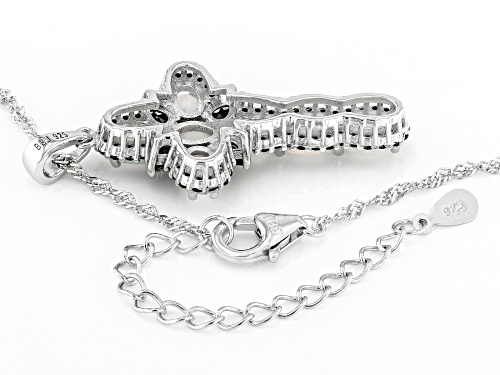 1.76ctw Oval Ethiopian Opal With .90ctw Black Spinel Rhodium Over Silver Cross Pendant With Chain