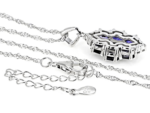 1.80ctw Oval Iolite With 0.28ctw Round White Zircon Rhodium Over Sterling Silver Ring.