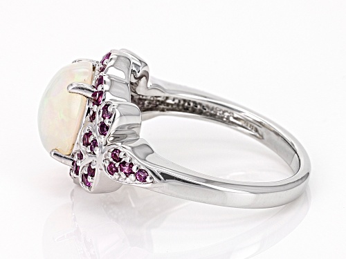 1.39ct Oval Ethiopian Opal With 0.53ctw Round Magenta Rhodolite Rhodium Over Silver Ring - Size 7