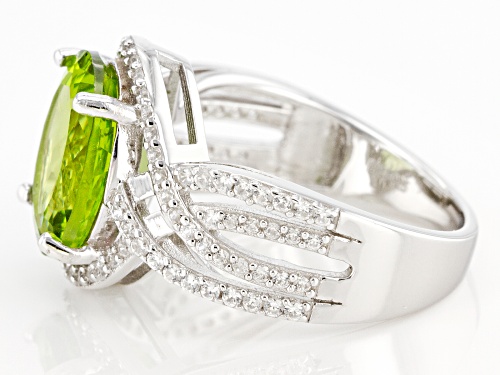 4.50ct Oval Manchurian Peridot™ With 0.57ctw Round White Zircon Rhodium Over Silver Ring - Size 6