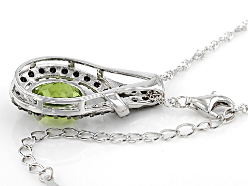 3.15ct Oval Peridot With .95ctw Round Black Spinel Rhodium Over Silver Pendant With Chain