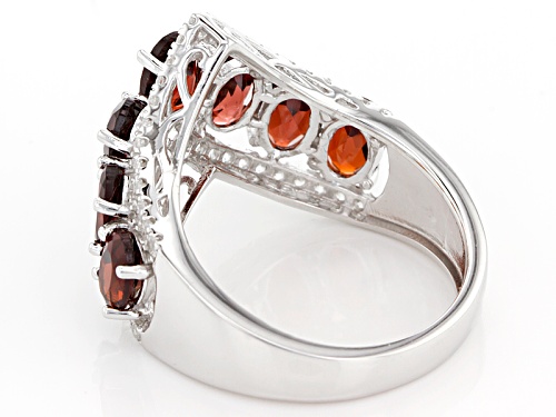 3.50ctw Oval Red Garnet With .67ctw Round White Zircon Rhodium Over Sterling Silver Chevron Ring - Size 7