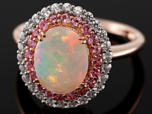 1.30ct Oval Ethiopian Opal With .27ctw Round Pink Spinel And .51ctw White Zircon 10k Rose Gold Ring - Size 12