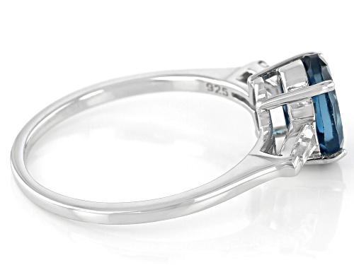 1.32ct Oval London Blue Topaz With .17ctw Tapered Baguette White Topaz Rhodium Over Silver Ring - Size 9