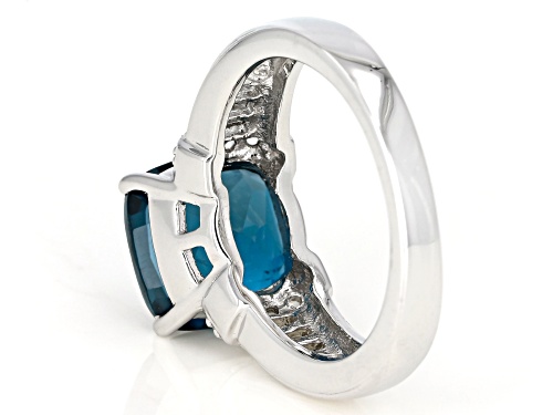 5.00CT LONDON BLUE TOPAZ WITH .42CTW BAGUETTE & ROUND WHITE TOPAZ RHODIUM OVER STERLING SILVER RING - Size 10