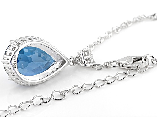 5.95CTW LONDON BLUE TOPAZ WITH .67CTW WHITE ZIRCON RHODIUM OVER STERLING SILVER PENDANT WITH CHAIN