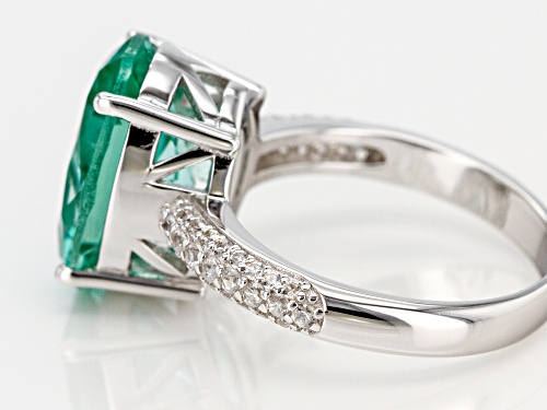 5.48CT OVAL LAB CREATED GREEN SPINEL WITH .37CTW WHITE ZIRCON RHODIUM OVER SILVER RING - Size 7