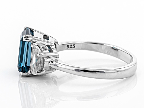 2.55CT EMERALD CUT LONDON BLUE TOPAZ WITH 1.19CTW CRESCENT WHITE ZIRCON RHODIUM OVER SILVER RING - Size 10
