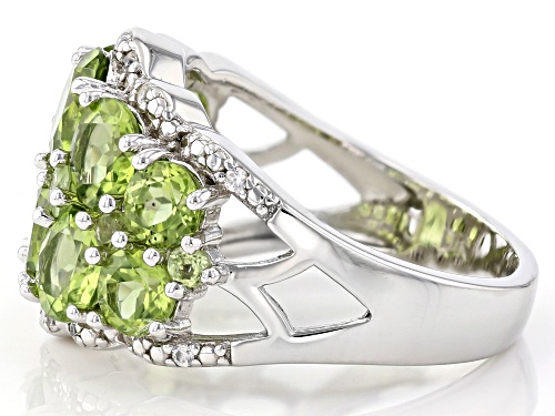 4.34ctw Round Manchurian Peridot(TM) With .15ctw Zircon Rhodium Over Silver Band Ring - Size 7