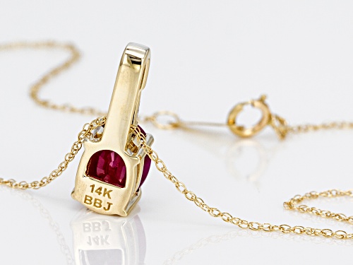 1.55ct Oval Ruby With .06ct Baguette Single White Diamond Accent 14k Yellow Gold Pendant with Chain