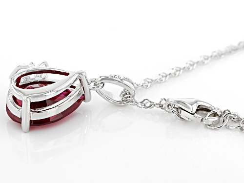 3.86ct Pear Shape Lab Created Ruby & 0.07ctw White Topaz Rhodium Over Silver Pendant W/Chain