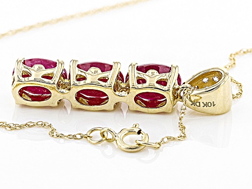 Pre-Owned 2.16ctw Oval Ruby With .02ctw Round White Zircon 10k Yellow Gold 3 Stone Pendant With Chai