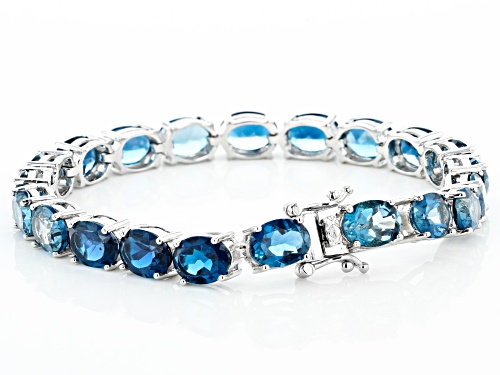 Pre-Owned 27.00ctw Oval London Blue Topaz Rhodium Over Sterling Silver Tennis Bracelet - Size 7.25