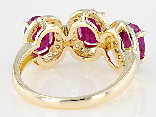 2.19ctw Oval Mozambique Ruby With .45ctw Round White Zircon 10k Yellow Gold 3-Stone Ring. - Size 7