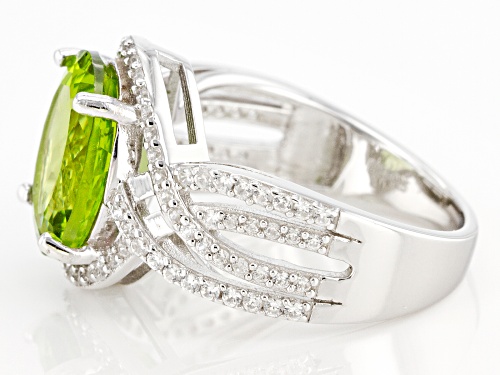 Pre-Owned 4.50ctw Oval Green Peridot With 0.57ctw Round White Zircon Rhodium Over Silver Ring - Size 6