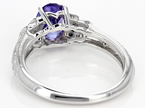 1.10CT OVAL TANZANITE AND .08CTW ROUND BLUE DIAMOND ACCENT RHODIUM OVER SILVER RING - Size 10