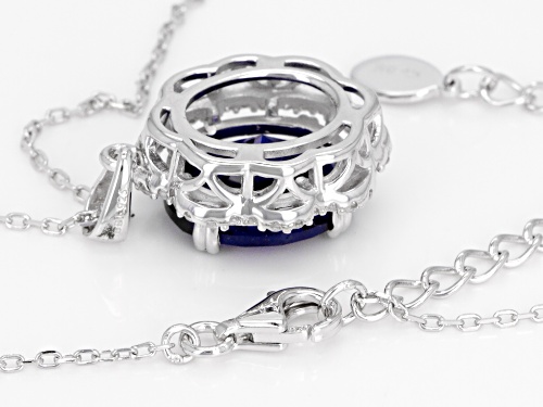 4.05CT OVAL LAB CREATED BLUE SPINEL WITH .39CTW ROUND ZIRCON STERLING SILVER PENDANT WITH CHAIN