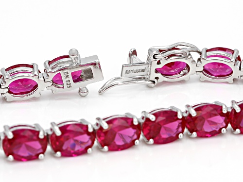 26.13ctw Oval Lab Created Ruby Rhodium Over Sterling Silver Tennis BraceletT - Size 7.25