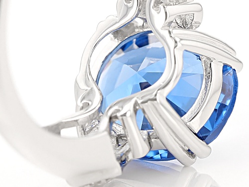 4.25ct Oval Lab Created Blue Spinel And .09ctw Round White Zircon Sterling Silver Ring - Size 12