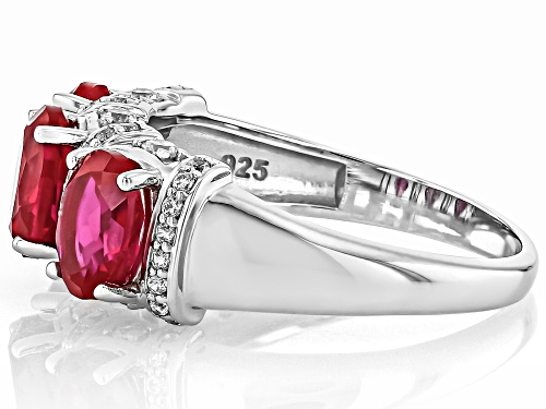 2.95ct Oval Lab Created Ruby With .042ctw Round White Zircon Rhodium Over Silver Ring - Size 6