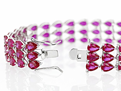 52.79ctw Pear Shape Lab Created Ruby Rhodium Over Sterling Silver Tennis Bracelet - Size 8