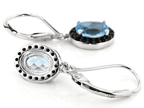 1.7ctw oval Swiss blue topaz with .29ctw round black spinel rhodium over silver dangle earrings
