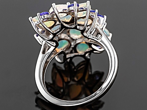 3.57ctw Pear Shape Ethiopian Opal With .74ctw Round Tanzanite Rhodium Over Sterling Silver Ring - Size 8