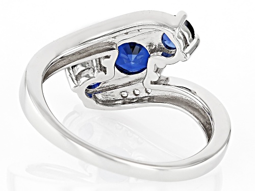 1.33ctw Round Lab Created Blue Sapphire With .07ctw White Zircon Rhodium Over Silver Bypass Ring - Size 10