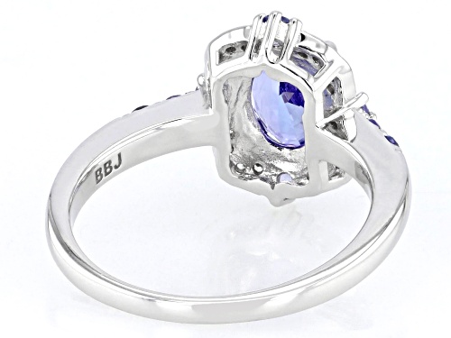 1.10ct Oval And 0.20ctw Round Tanzanite With .06ctw White Zircon Rhodium Over Silver Ring - Size 9
